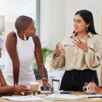 a female colleague explaining what is permanent establishment risk
