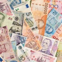 International currency notes overlapping each other