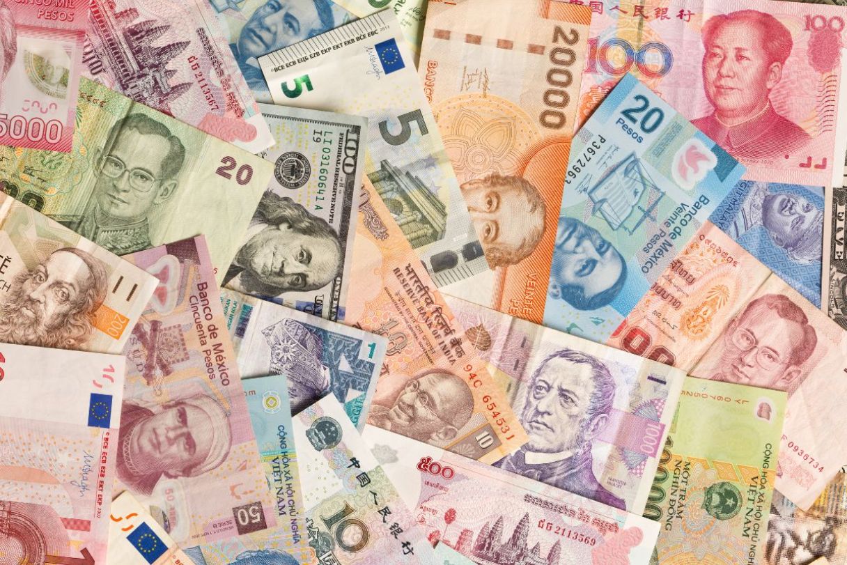 International currency notes overlapping each other