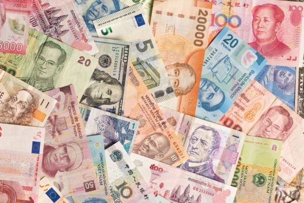 International currency notes overlapping each other
