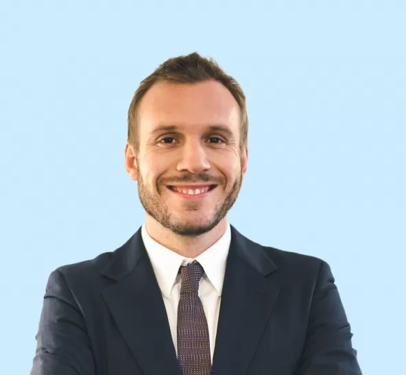 Jonathan Ellis Headshot with Light Blue Background